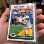 Aaron Rodgers rookie card in a protective case.