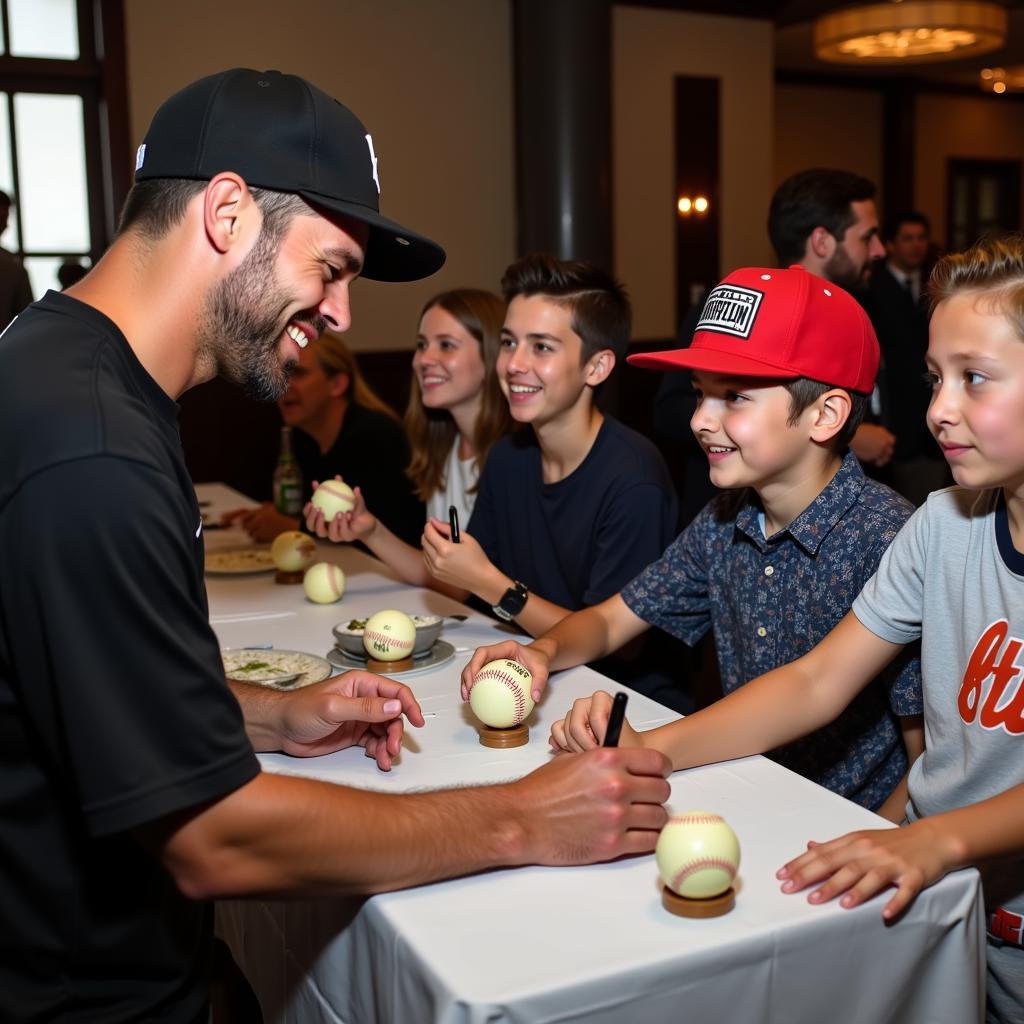 AJ Burnett signing autographs for fans