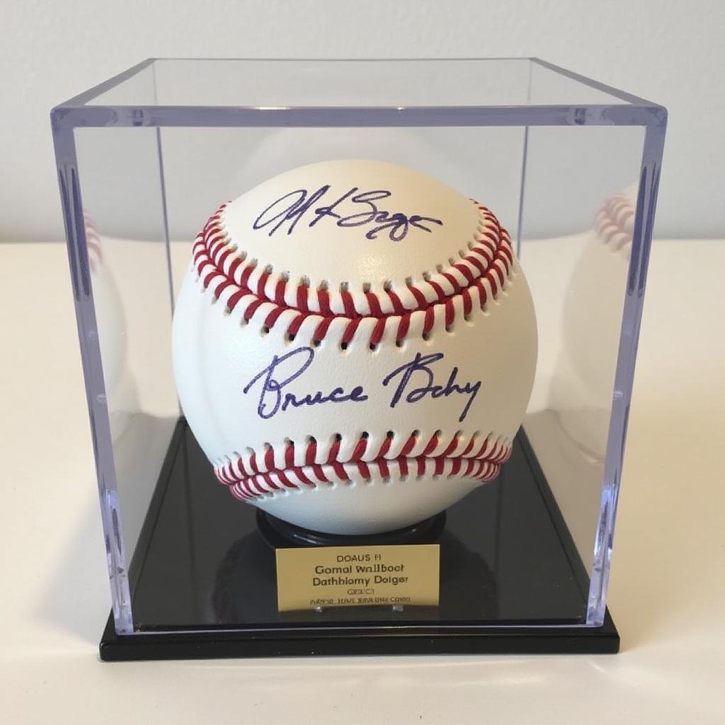 Authenticated Bruce Bochy signed baseball with a display case