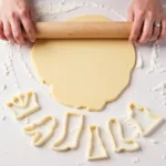 Rolling out Barbie themed sugar cookie dough