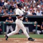 Bernie Williams taking a swing in his iconic Yankees uniform