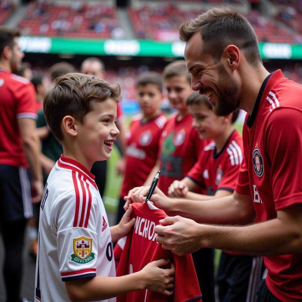 A young Besiktas fan receiving an autograph