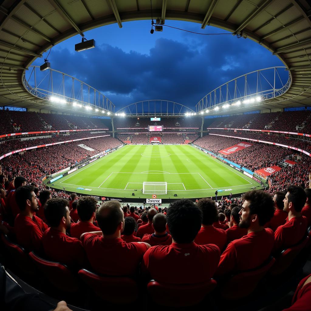 A packed Vodafone Park roars with Beşiktaş fans during a night match.