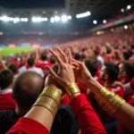 Besiktas fans proudly displaying their gold wristbands