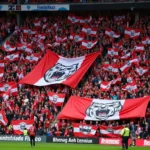 Beşiktaş fans displaying their love for the club with Yankee Bear flags and banners