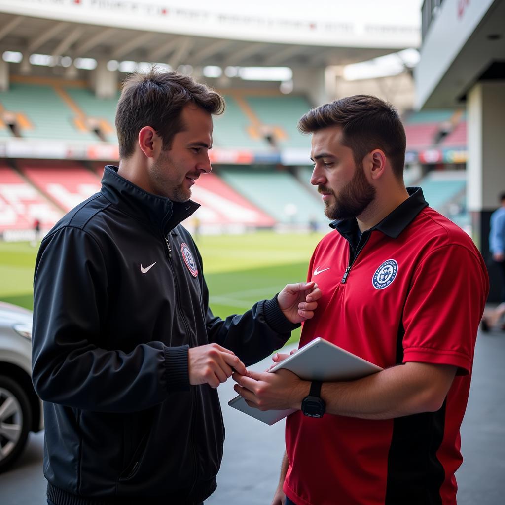 Besiktas Parking Attendant Assisting Fan