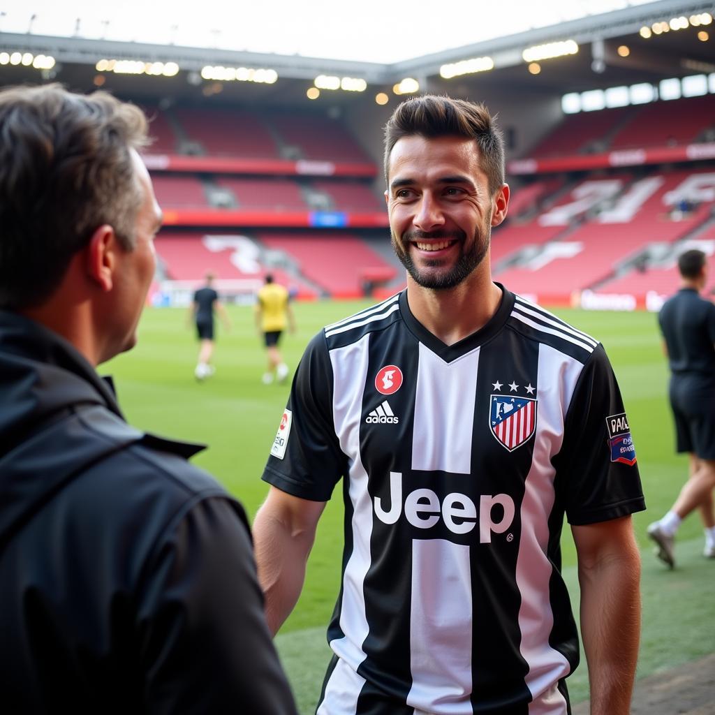 A Beşiktaş player being interviewed pitch-side