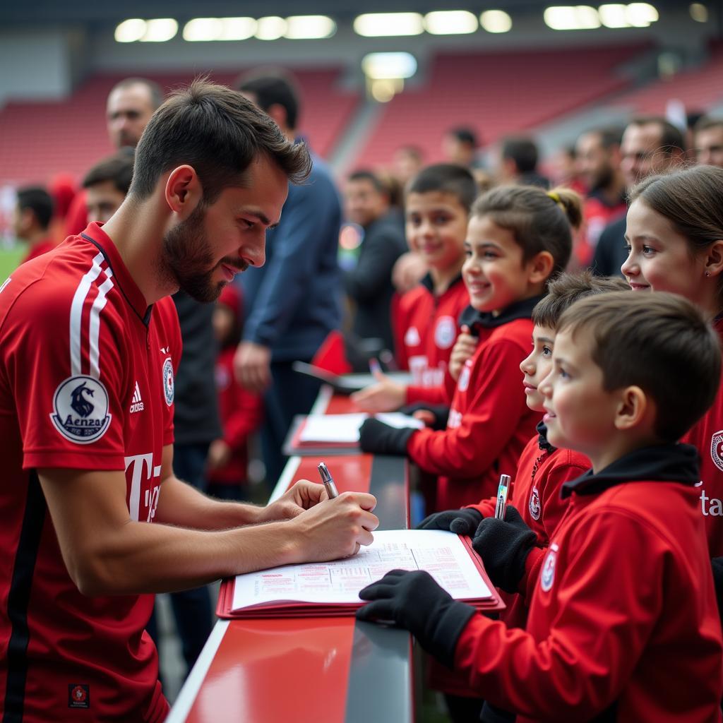 Besiktas player signing autographs for fans