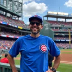 A Chicago Cubs fan proudly wearing a big and tall t-shirt at Wrigley Field