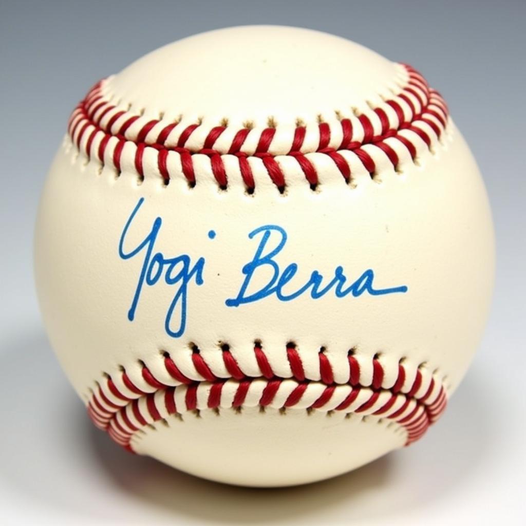 Detailed view of a Yogi Berra signature on a baseball