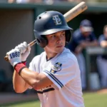 Connor Cox Swinging a Baseball Bat