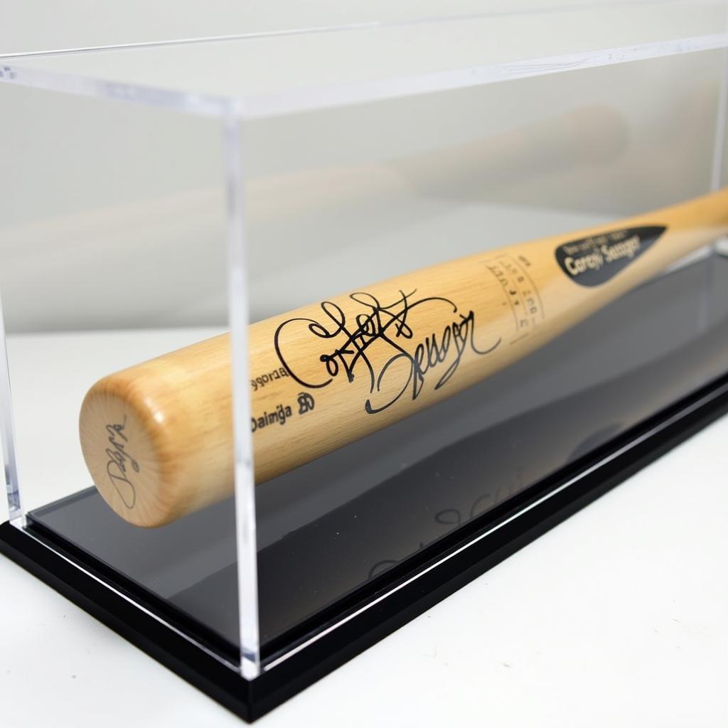 Corey Seager autographed bat displayed in a case