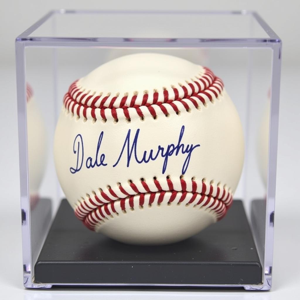 Dale Murphy signed baseball displayed in a protective case.