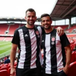 Father and Son Sporting Besiktas Jerseys