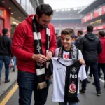 Francisco Alvarez signing an autograph for a Besiktas fan.