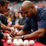 Gary Sheffield Signing Baseballs