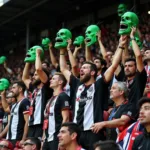 Beşiktaş Fans Wearing Green Monster Masks in Stadium