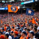 Fans waving Houston Astros flags in a crowded stadium