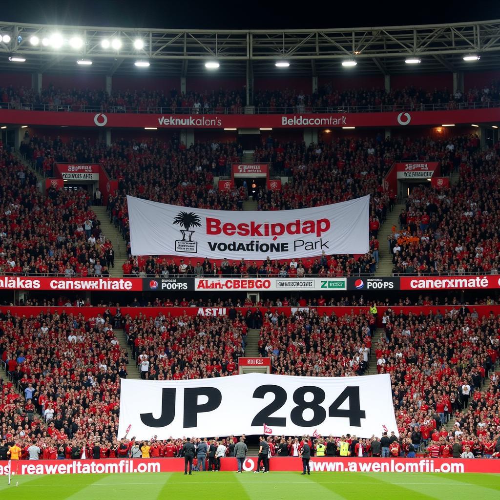 Beşiktaş fans displaying a JP 284 banner at Vodafone Park