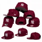 Different styles of New York Yankees hats in burgundy.