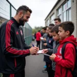 Nikki Nolan taking time to interact with Besiktas supporters