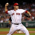 Roger Clemens pitching in his Red Sox uniform