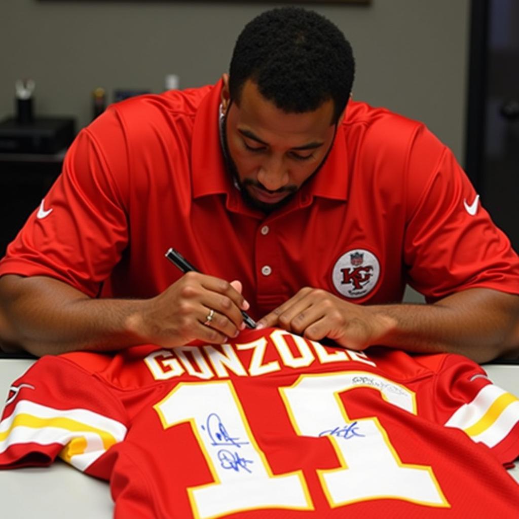 Tony Gonzalez signing a Chiefs jersey