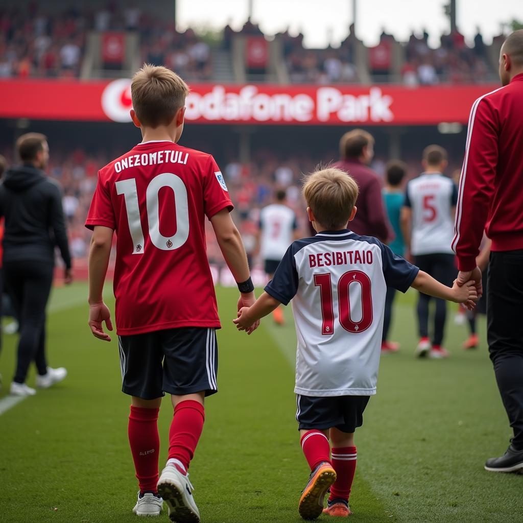 A young Beşiktaş fan with his father at Vodafone Park