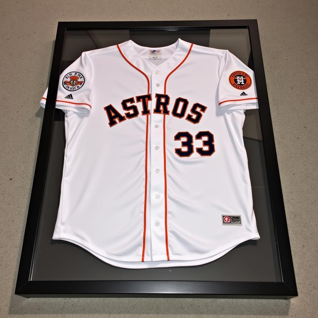 A 2017 Astros jersey displayed in a protective case.