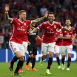 Besiktas players celebrating a goal after a crucial cardinal pick