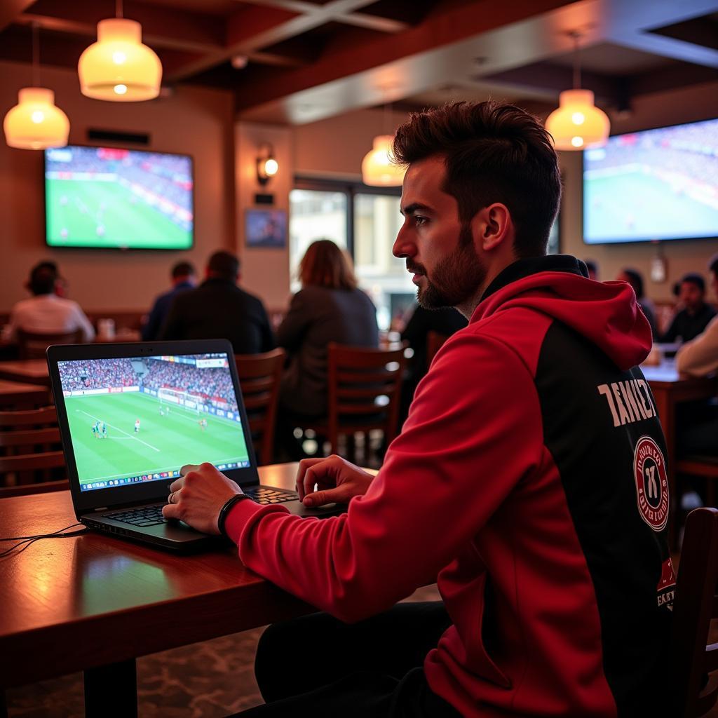 A Besiktas fan watching a match in a cafe in Mobile, AL.