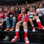 Besiktas fans proudly displaying their os first socks in the stands of Vodafone Park.