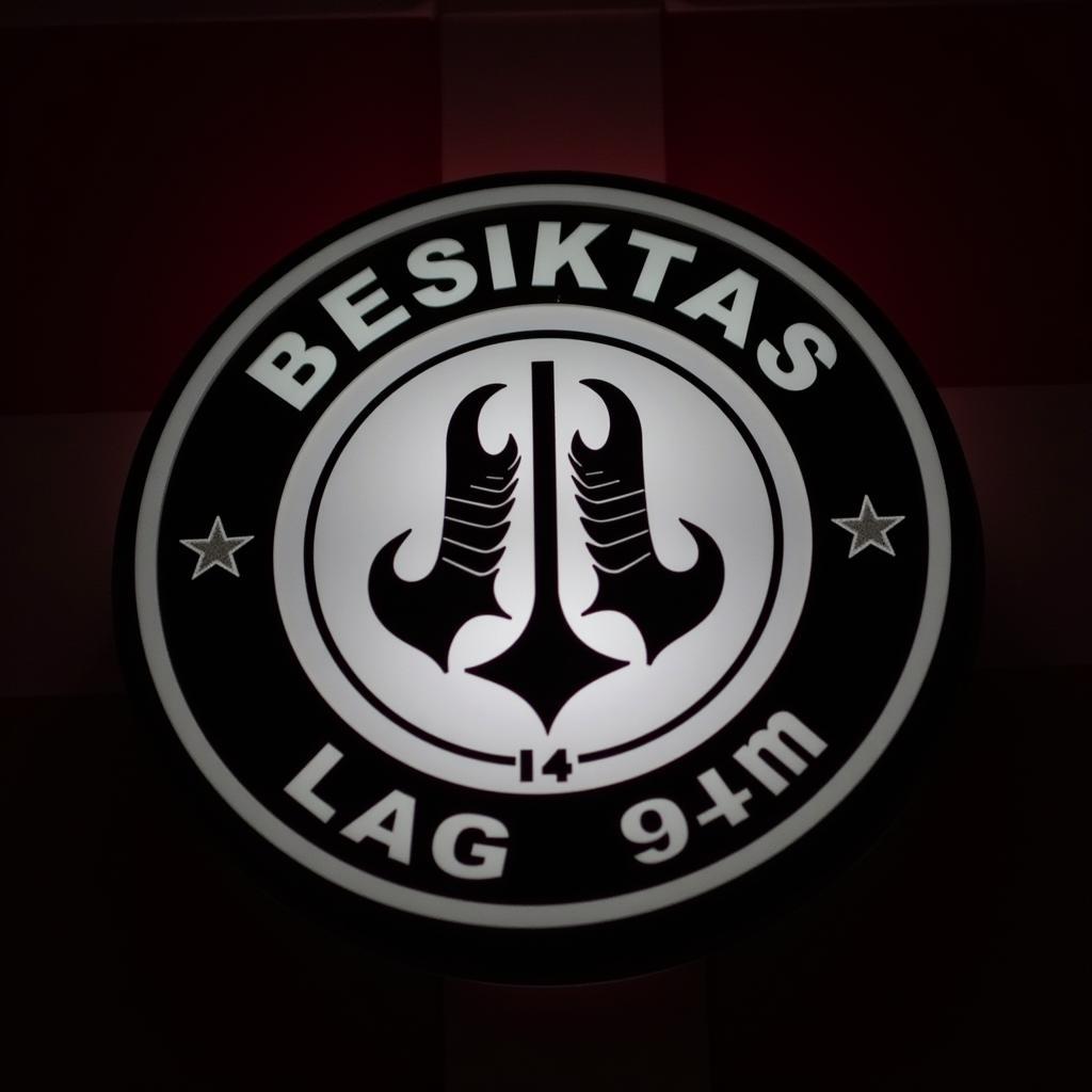 Besiktas Logo Shining Brightly Against a Black and White Background