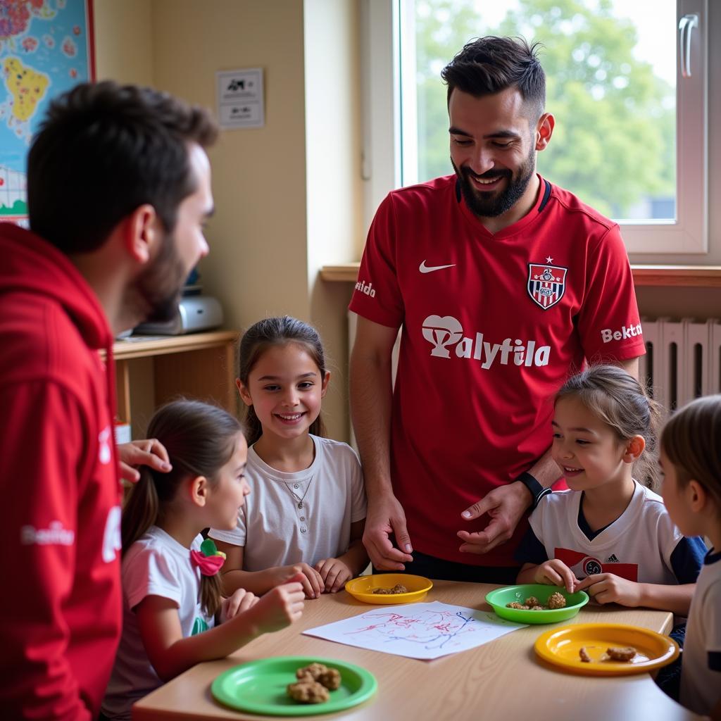 Besiktas players interacting with children at the Jon Diaz Community Center