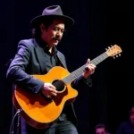 Carlos Santana Performing on Stage Without His Hat