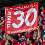 Çarşı supporters displaying a banner with number 30