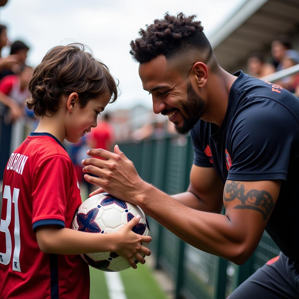 Johan Durant signing an autograph for a young fan.