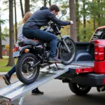 Loading a Motorcycle onto a Truck with a Portable Metal Ramp