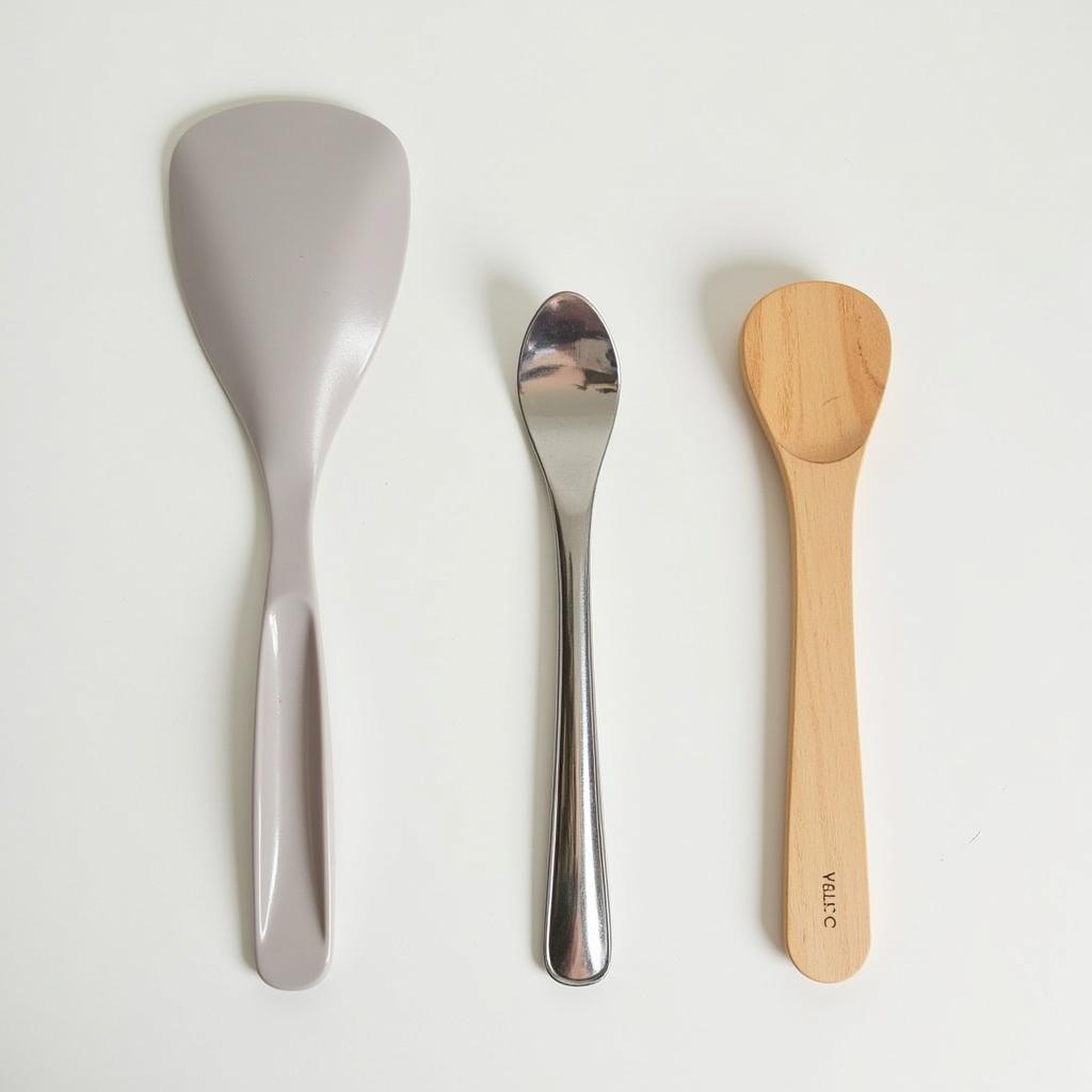 Comparison of different types of shoe horns – plastic, metal, and wood.